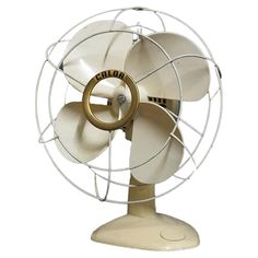 an old style fan with two blades on the front and one blade on the back