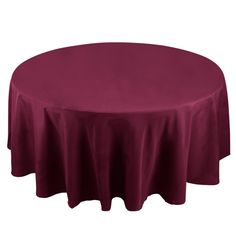 a round table with a maroon cloth on it