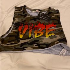 Vibe Crop Top In Camouflage Trendy Camouflage Summer Top, Trendy Summer Camouflage Top, Trendy Camouflage Tops For Summer, Spring Camouflage Tops With Graphic Print, Camouflage Tops With Graphic Print For Spring, Trendy Camouflage Tops For Spring, Casual Camouflage Sleeveless Top, Casual Camouflage Tank Top For Summer, Sleeveless Camouflage Top For Spring