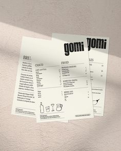 two pieces of paper with the words gomi yomi on them sitting next to each other