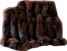 a brown and black fur pillow sitting on top of a white floor