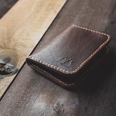 The Katahdin vertical leather card wallet is as classic as its namesake Mount Katahdin in Maine's Great North Woods. The full grain leather wallet is as tough as it is beautiful, calling to mind the pine laden forests surrounding Maine's tallest granite peak. Featuring four card pockets and 2 larger pockets in the back for money, business cards, or receipts, this sturdy wallet will stand the test of time. Made from leather sourced in Maine, the wallet features a rustic texture that will take on Mount Katahdin, Full Grain Leather Wallet, Rustic Texture, Leather Card Wallet, Tin Ceiling, Leather Thread, Contemporary Crafts, Timeless Accessories, Bifold Wallet