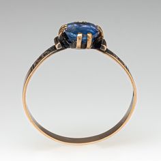 This beautiful circa late-Victorian ring contains one (1) cushion mixed cut natural sapphire weighing 1.92 carats and set into a four-split prong head. Engraved details accent the shoulders of the shank. The ring measures 10.2mm at the top, rises 4.0mm above the finger, tapering to 3.4mm wide and 0.6mm thick at the base of the shank. The ring is currently size 7.5 and has a nice aged patina. Antique Cushion Cut Rings For Formal Occasions, Antique Oval Sapphire Ring With Rose Cut Diamonds, Antique Cushion Cut Rose Diamonds Jewelry, Antique Sapphire Ring With 17 Jewels, Victorian Sapphire Ring With Rose Cut Diamonds, Antique Cushion Cut Jewelry With Center Stone, Antique Cushion Cut Stone Jewelry, Victorian Sapphire Oval Rings, Heirloom Cushion Cut Sapphire Ring With Center Stone