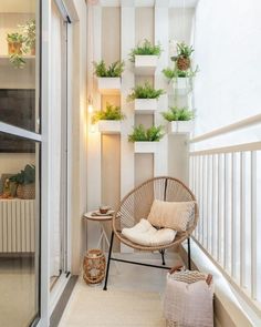 the balcony is decorated with plants and wicker furniture