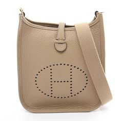 HERMES Evelyne TPM Shoulder Bag 069426CC Taurillon Clemence GHW Beige Marfa Used Description / Specification Brand Name HERMES Item Name HERMES Evelyne TPM Shoulder Bag 069426CC Taurillon Clemence GHW Beige Marfa Used Color Beige Marfa / Beige‐ish colors Material Taurillon Clemence × Taurillon Clemence Size H:18cm x W:16.5cm x D:5.5cm (H:7.1" x W:6.5" x D:2.2") Shoulder：112cm(44.1") Accessories Box/Dustbag Accessories not stated are not included. (If there is no mention of a box or dust bag, they are not included either.) Stamp W stamped (manufactured in 2024) Date Code WTS002AU Instore Code 2104102306256 Up Date 2024/10/01 Condition New unused Shoulder Bag by HERMES in excellent condition. Outside Condition There is an Unnoticeable Scratches and Stains on it. * Slight rubbing may occur on Hermes Evelyne Tpm, Hardware Jewelry, H Logos, Accessories Box, Light Stain, Ballet Flat Shoes, Party Accessories, Clothes For Sale, Luxury Bags