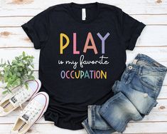 Pediatric Occupational Therapy Play is my favorite Occupation Shirt - Unisex T Shirt, Women Racerback Tank, Long Sleeve T-Shirt Tees Tshirt Sweatshirt Sweater Hoodie Gift For Men Women Boys Girls Occupational Therapy, OT gift, friend gift, Pediatric gift, Pediatric OT shirt, COTA, Play OT shirt, Pediatric OT gift, Pediatric OT tee, Pediatric OT t-shirt, OT sister gift, OTA t-shirts, OT quote shirt Well, let's say goodbye to all this boring apparel... The GodBlessThisDesign team creates custom clothes with great designs to suit all tastes. Our unique and blessed designs are a blast fit for every occasion and always a perfect fit... We combine our beautiful designs with high quality apparel like no one has ever done before. There's nothing worse than being charmed by a nice design and then f Pediatric Speech Therapy, Pta Gifts, Physical Therapy Shirts, Speech Therapist Gift, Occupational Therapy Shirts, Slp Shirts, Speech Therapy Shirts, Pediatric Physical Therapy, Pediatric Occupational Therapy