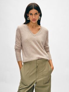 The ultimate relaxed-but-still-polished sweater, the Cashmere V Neck is a wardrobe staple that you'll love to live in. It’s spun from soft, lightweight cashmere for a straight fit with a flattering V-neckline and neatly ribbed trim. The minimal styling will make a great pairing with a high-waisted skirt or wide-leg jean. Details Straight fit. Long sleeve. Length in size small is 23" The model is 5'10 1/2" and is wearing a size small. 100% Cashmere. Hand wash cold or dry clean. Do not twist or wr Cashmere Travel Wrap, Cardigan Top, Sweater Sale, Knitwear Cardigan, Fall Shopping, Heather Black, Knitwear Women, Wardrobe Staples, Leg Jeans