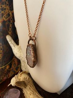 This is a copper electroformed aura rose quartz necklace. It was handmade by me in Calgary, Alberta. The pendant itself measures approximately 2" long, 3/4" wide and hangs on a  24" chain with a lobster claw closure.  You will receive the exact necklace as pictured, and it is ready to ship! Your necklace from Prairie House of Boho will arrive gift wrapped with care instructions Aura Rose Quartz, Prairie House, Boho Goth, Rose Quartz Necklace, Calgary Alberta, Copper Pendant, Jewelry Boho, Copper Pendants, Pink Quartz