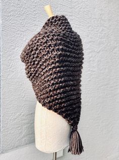 Hand knitted Outlander inspired shawl, scarf, shoulder wrap, neck warmer in marled brown with a hint of pale purple. - triangle design, can be worn in many different ways - one size fits all - made with 1 tassel, please let me know if you prefer 3 tassel (on each tip) or no tassels - super soft 50% acrylic, 30% wool, 20% mohair yarn - available in any color or yarn imaginable, please contact me for custom orders - made in smoke and pet free environment CARE: Hand wash , air dry. Handmade Yarn Shawl For Winter, Hand Knitted Yarn Shawl For Winter, Winter Hand Knitted Yarn Shawl, Handmade Cozy Shawl For Winter, Handmade Cozy Winter Shawl, Brown Crochet Shawl For Fall, Fall Crochet Brown Shawl, Cozy Handmade Winter Shawl, Crochet Wrap, One Size For Winter