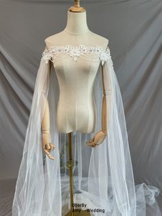 a mannequin wearing a white wedding veil