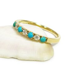 Handmade from 14 karats yellow gold, this stacking ring features seven rounded gemstones alternating between 0.1-carat diamonds and bright blue turquoise.  #jonjonjewel #turquoisejewelry #weddingring Turquoise And Diamond Ring, Gold Turquoise Ring, Ring For Women Gold, Turquoise Diamond Rings, Turquoise Wedding Rings, Boho Wedding Ring, Boho Engagement Ring, Turquoise Ring Engagement, Turquoise Gold Ring