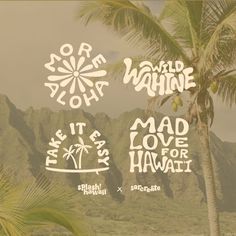 some stickers that are on the side of a palm tree in front of mountains