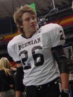 a football player is standing on the field