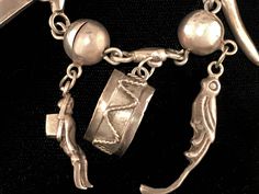 "Vintage Mexican sterling silver bracelet with Peruvian/South American style charms and silver balls, circa 1940s. Bracelet is 6 1/2\" long, with silver ball design and 9 charms ranging in size from 1/2\" to 1 1/2\" long. The charms include a drum, parrot, banana, person with basket, a coffee/cocoa bean, and other symbols. The bracelet has a box clasp with \"Hecho en Mexico\" stamped on the back. We ship with USPS, insured for the full value of the item." Vintage Silver Bracelet With Silver Beads, Heirloom Silver Bracelet With Vintage Charm, Vintage Sterling Silver Charm Bracelet With Dangling Charms, Antique Sterling Silver Charm Bracelets, Antique Sterling Silver Bracelets With Charms, Vintage Sterling Silver Bracelet With Charm, Silver Dangle Charm Bracelet, Unique Silver Dangle Charm Bracelet, Vintage Sterling Silver Bracelets With Silver Beads