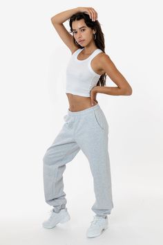 Made from a luxurious 14oz fleece, this sweatpants is incredibly soft and warm, yet still breathable and moisture-wicking. The relaxed fit allows for a full range of motion, making it perfect for lounging around the house, running errands, or hitting the gym. This sweatpant is Piece Dyed. Our piece-dyed sweatpants fabric is dyed before they're cut and sewn, which results in a more uniform color distribution throughout. This means you'll get pants with a cleaner, sharper look, without any color v Los Angeles Apparel, Denim Workwear, Fleece Sweatpants, Leather Denim, Ribbed Crop Top, Fleece Pants, Phone Wallet, Range Of Motion, Womens Sweatpants