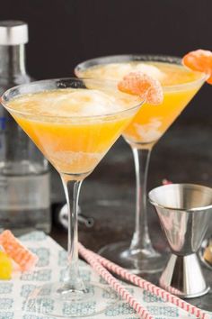 two martinis with orange juice and sugar on the rim