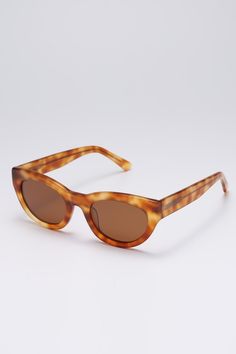 Frame: Brown tortoiseshell acetate Lenses: Brown Lenses: 52 mm, Bridge: 22 mm, Temples: 150 mm Brown tortoiseshell-acetate sunglasses shaped to an elegant cat-eye silhouette, offering a mix of functionality and retro elegance. They're made with brown tinted lenses for good UV protection. Tortoiseshell Cat-eye Sunglasses With Gradient Lenses, Classic Brown Acetate Cat Eye Sunglasses, Classic Brown Cat Eye Sunglasses In Acetate, Retro Tortoiseshell Cat Eye Sunglasses With Tinted Lenses, Classic Tortoiseshell Cat Eye Sunglasses With Polarized Lenses, Tortoiseshell Sunglasses With Uv Protection, Classic Tortoiseshell Cat Eye Sunglasses, Summer Tortoiseshell Acetate Sunglasses, Brown Acetate Cat Eye Sunglasses With Polarized Lenses