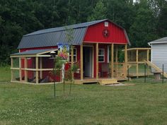 a small red house with a porch and stairs