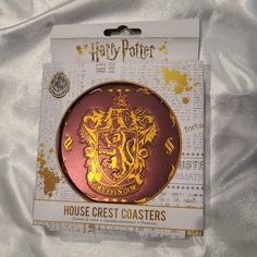 the hogwarts crest badge is in its packaging