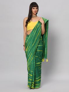 This light weight Green Tie dye saree is a versatile saree that is a must have in your wardrobe. This saree is extremely light weight will give you great pitures and can be worn for different ocassions. Team this saree up with Yellow raw silk blouse & statement earrings. Suitable for Poojas, Day function, brunhes, Wedding & haldi functions. Product Features: Saree Color: Green & yellow Blouse Color: Yellow Saree Fabric: Georgette silk Blouse Fabric: Raw Silk Saree Work: Tie Dye Print Wash Care: Tie Dye Saree, One Minute Saree, Saree Work, Yellow Tie Dye, Raw Silk Saree, Yellow Tie, Yellow Saree, Yellow Ties, Yellow Blouse