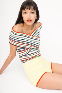 These stripes must be our all-time favorite! And the combination of the two types of yarn - peachskin and a super cute and soft terry cloth - make them all the more appealing and beach-ready. We created a few styles in this stripe, one of which is this popular off-shoulder, criss cross top that creates a beautiful neckline. Pair the top with the matching shorts for the most adorable full summer look. Content: 51% cotton, 34% nylon, 10% recycled lycra, 5% silk. Model is 5'8" and wearing size XS. Multicolor Striped Top For Summer, Summer Contrast Stripe Tops For Loungewear, Summer Loungewear Tops With Contrast Stripes, Playful Striped Tops For Beach, Playful Striped Tops For The Beach, Multicolor Tops With Contrast Stripes For Spring, Criss Cross Top, Cross Top, Types Of Yarn