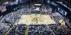 an aerial view of a basketball court with fans