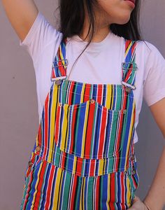 Vintage dungaree shorts in a multi colour stripe. Single chest pocket. Front and back lower pockets. Adjustable shoulder straps. Size small, UK 6-8 / EUR 34-36. Measurements - 7"(18cm) bib height - 13"(33cm) bib width - 28"(71cm) waist - 34"(87cm) hips - 7"(18cm) inner leg. Material - Cotton. Condition - Excellent. Handpicked, repaired and ready to wear. This is an original vintage item, not new and minor signs of wear & age are expected, we will highlight any major flaws.Model is a UK 8 and is 5'6" tall. Striped Overalls With Pockets For Summer, Summer Striped Cotton Overalls, Casual Striped Overalls With Pockets, Dungaree Shorts, Womens Denim Overalls, Silly Clothes, Overalls Denim, Dungarees Shorts, Womens Denim