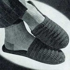 the feet of a person wearing socks and slippers