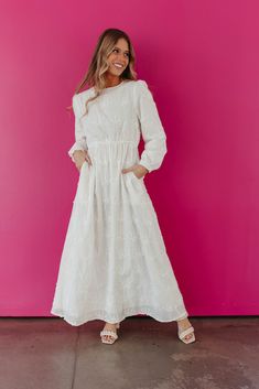 Stay sweet and cute in THE WINNEE MAXI EYELET DRESS. With a charming eyelet design and convenient pockets, this long sleeve dress is perfect for any occasion. Embrace the pure white color and effortlessly stand out in style. Long Sleeve Eyelet Temple Friendly Maxi length Pockets Self: 100% rayon, Lining: 100% polyester Dress is true to size. Small (0-2), Medium (4-6), Large (8-10), X-Large (10-12). Length (shoulder to hem): Small: 55.5", Medium: 56", Large: 56.5", X-Large: 57". Model is 5'5" wea Temple Dresses For Women, White Temple Dress, Lds Temple Dresses, Lds Temple Dress, Temple Dresses, Young Wedding, White Temple, Temple Dress, Eyelet Dress