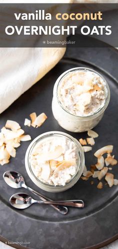 two jars filled with overnight oats on top of a black plate