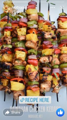 the skewers are piled high on top of each other and ready to be grilled