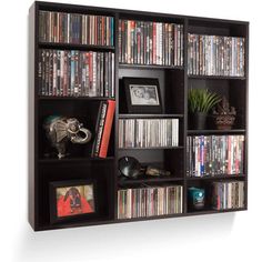 an entertainment center with many different types of dvd's