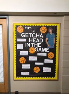 a bulletin board with an image of a basketball player and the words getcha head in the game