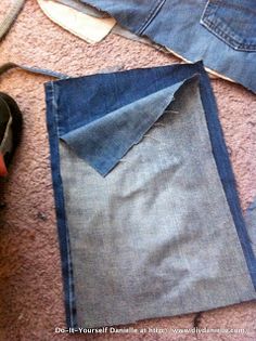 the jeans are laying on the floor and ready to be sewn into something else