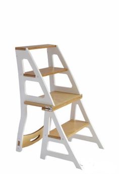 a white wooden step stool with two shelves