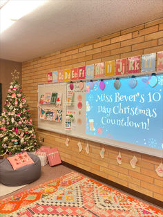 a christmas tree is in front of a bulletin board