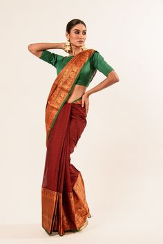 The Maroon Colour Pure Mangalagiri Handloom Saree in Gold and Green Border combines classic beauty with timeless tradition. Shop now from our collection. Classic Traditional Wear With Traditional Drape For Festive Occasions, Classic Festive Traditional Wear With Traditional Drape, Elegant Tilla Pre-draped Saree With Traditional Drape, Elegant Pre-draped Saree With Tilla In Traditional Drape, Elegant Pre-draped Saree With Tilla Embroidery, Elegant Tilla Pre-draped Saree, Elegant Pre-draped Saree For Festivals With Tilla, Elegant Saree With Tilla In Traditional Drape, Traditional Pre-draped Saree For Navratri With Tilla Details