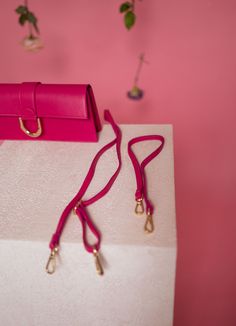 Gorgeous hot pink rectangular bag with a golden buckle and comes with two straps, one short and one long. Perfect for any occasion. Colors: pink - green Length 11.03 in - Width 1.97 in Contexture: genuine leather Daily Use Bags With Gold-tone Hardware And Rectangular Case, Rectangular Case Bag With Gold-tone Hardware For Daily Use, Rectangular Box Bag With Gold-tone Hardware For Daily Use, Everyday Bags With Gold-tone Hardware And Rectangular Shape, Rectangular Bag Strap With Detachable Handle For Daily Use, Pink Rectangular Box Bag For Daily Use, Chic Pink Rectangular Case Shoulder Bag, Luxury Pink Box Bag With Adjustable Strap, Rectangular Bag Strap For Daily Use