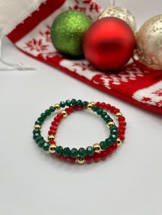 "This Christmas bracelet is perfect to dress up any holiday outfit this season! Make it a stack by combining multiple bracelet designs from the Christmas Collection. ♥️ This bracelet consists of red or green faceted beads and 14k gold filled beads hand-strung on high performance elastic allowing it to easily stretch on and off your wrist. ♥️ Each bracelet will be made at 6.5-7\" (the average adult female wrist size) unless otherwise specified. Custom size orders are welcome. Please add a note to Bracelets Christmas, Velvet Storage, Multiple Bracelets, Bracelet Christmas, Care Care, Christmas Bead, Christmas Bracelet, Holiday Outfit, Holiday Jewelry