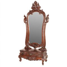 an ornate wooden dressing table with mirror