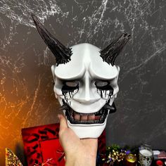 Japanese Crying Hannya mask is an incredible addition to any collection. Hannya mask would be great for a Halloween or cosplay event! If you want a cutom made mask, just write me DM and describe idea. There is a soft pad for comfort inside the mask, also comes with a wide strap and elastic bands.  Suitable to hang on the wall. (If you want to hang the mask on the wall, you need to thread the mask and tie it tightly.) It has been carefully crafted from durable, hypoallergenic resin, making it saf Fire Mask Design, Artistic White Masquerade Mask For Halloween, White Fantasy Masks For Halloween, White Masks For Halloween Fantasy Events, Artistic White Masks And Prosthetics For Halloween, Samurai Style Black Mask For Masquerade, Artistic Halloween Masks For Fantasy Events, Samurai Masks For Halloween Cosplay, Samurai Mask For Halloween