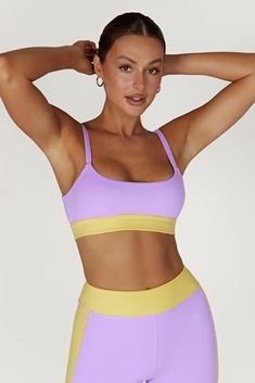 Race you to the top. Our BECCA Two Tone Cropped Sports Bra is designed with a cropped length, fully-lined, bodycon fit, wide straps and the option to remove the bust cups, making it a perfect choice for high impact sports or simply supportive for lounging. We’ve also incorporated our silicone MESHKI logo detailing throughout and our ultra soft FLEXI Butter fabrication for a supportive fit. Everyone at HQ is pairing this with our Alexandra Oversized Button Up Shirt and Taleah Two Tone Shorts to c Yellow Crop Top With Built-in Bra, Yellow Stretch Sleeveless Sports Bra, Yellow Sleeveless Stretch Sports Bra, Yellow Stretch Sports Bra, Sporty Crop Top With Built-in Bra And Wide Straps, Yellow Stretch Sports Bra Athleisure, Yellow Stretch Sports Bra For Workout, Yellow Sleeveless Sports Bra For Gym, Sports Crop Top With Adjustable Straps