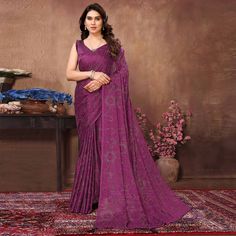 Purple colored saree is made from georgette rangoli silk (Poly Silk) fabric which is highlighted with beautiful mukaish & foil printed work with tassels border as shown. comes along unstitched banglori silk blouse piece which you can customise as per your design/style. Occasion - You can buy this saree for party and functions. Note:- The actual product may differ slightly in color and design from the one illustrated in the images when compared with computer or mobile screen. Measurements: Saree Purple Saree With Printed Border For Diwali, Bollywood Style Purple Saree With Printed Border, Diwali Purple Saree With Printed Border, Saree For Party, Mobile Screen, Printed Silk, Foil Print, Blouse Piece, Design Style