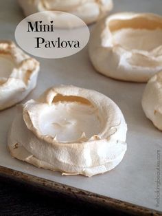 mini pavlova on a baking sheet ready to go into the oven with text overlay