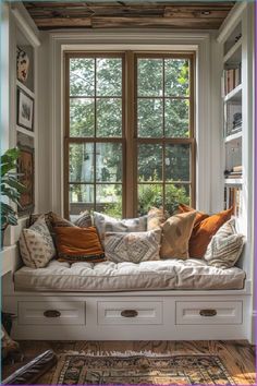 a window seat with lots of pillows on it