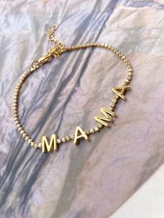 • gold plated • cubic zirconia • adjustable bracelet Gold Name Bracelet With Letter Beads, Gold Name Bracelet With Letter Beads For Mother's Day, Mother's Day Gold Name Bracelet With Letter Beads, Tennis Design, Mama Bracelet, Cz Bracelet, Bracelet And Necklace, Botswana, Fine Jewellery Earrings