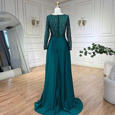 Exquisite mermaid gown in an elegant green hue, perfect for weddings, parties, and formal events. Crafted from luxurious satin, adorned with intricate lace and beaded embellishments for added glamour. Features a sophisticated mermaid silhouette that beautifully accentuates the feminine figure. Designed with high-quality materials for a comfortable and opulent feel. Ideal attire for women attending weddings, gala events, evening parties, and special occasions. Inspired by luxurious Dubai and Arab Dubai Evening, Beaded Embellishments, Gowns For Women, Green Mermaid, Gala Events, Mermaid Silhouette, Mermaid Gown, Beaded Lace, Formal Occasion