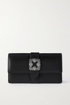 What better way to feel glamorous than with a Manolo Blahnik accessory? This 'Capri' clutch is made from smooth leather and is centered with the iconic crystal-set buckle. Embrace matchy-matchy styling with a pair of the designer's coordinating pumps. Classic Leather Clutch For Events, Luxury Embellished Clutch For Cocktails, Designer Clutch For Cocktail Events, Luxury Clutch With Silver-tone Hardware, Luxury Evening Clutch With Silver-tone Hardware, Luxury Formal Clutch With Silver-tone Hardware, Designer Embellished Formal Clutch, Elegant Leather Evening Bag For Events, Evening Clutch With Palladium Hardware