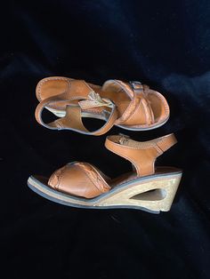 Very funky 1950's brown leather sandals with wooden cut out wedge heels. Bottoms are a soft black material, one shoe is missing a chunk of the soft bottom by the heel, shown in photo. I have not repaired. Wood heels have some scratches. Being sold as is Women's size 5 Rhinestone Belt Buckle, Wood Heels, Womens Espadrilles Wedges, Women's Espadrilles, Rhinestone Belt, Wood Heel, Brown Leather Sandals, Espadrilles Wedges, Soft Black