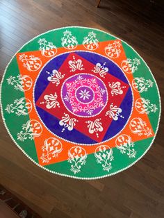 a brightly colored rug on the floor in an empty room